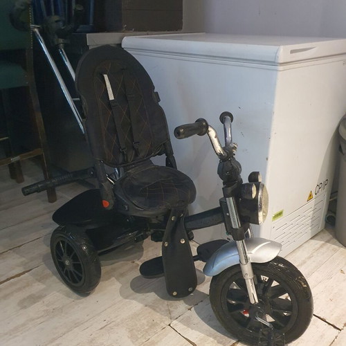 Tricycle used with some fabric wear and missing parts