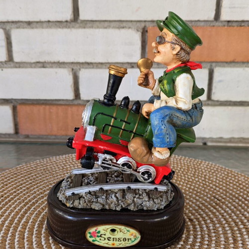 Decorative figure with motion sensor used, train engineer on locomotive