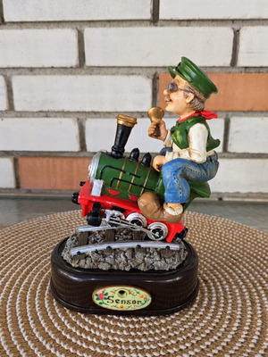 Decorative figure with motion sensor used, train engineer on locomotive
