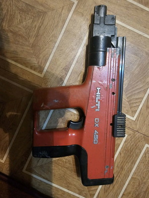 Hilti DX450 nailer used with nails and cartridges