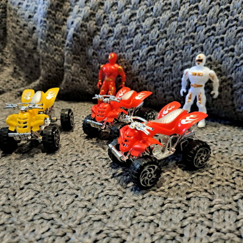 Toy set with action figures and small ATV vehicles used