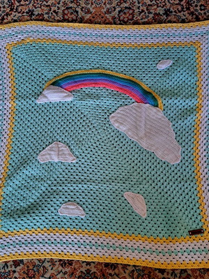 Baby knitted blanket handmade with rainbow design