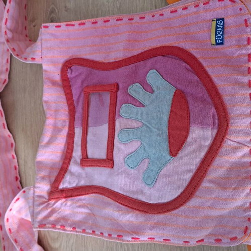 Cloth bag with doll and clothes used