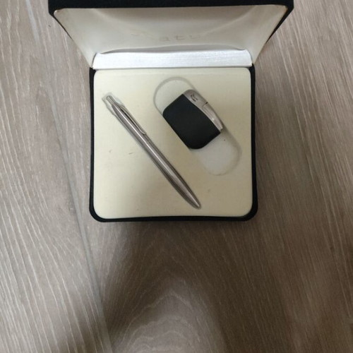 Gift set with lighters, pens, keychain, and calculator