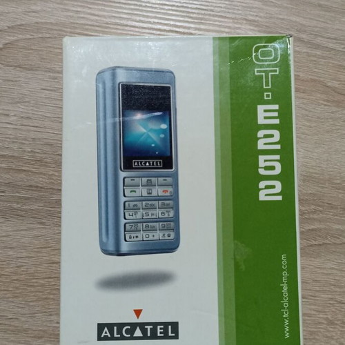 Alcatel cell phone new, black with buttons and accessories