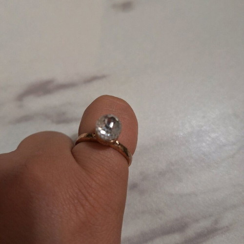 Ring with round shiny stone
