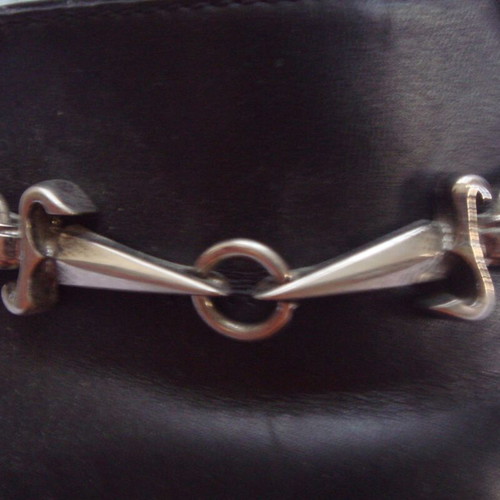 Cesare Paciotti black leather pumps used with chain detail