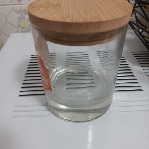 Candle container with wooden lid