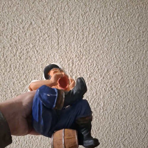 Porcelain figure new, man sitting on barrel