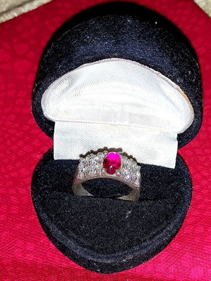 Silver ring with red stone used