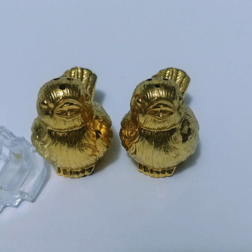 Set of gilded miniature salt and pepper shakers with lead tray