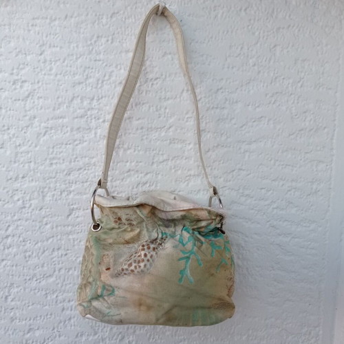 Shoulder bag in pouch style with leather details