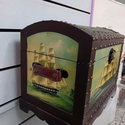Small trunk used with ship decor and leather handles