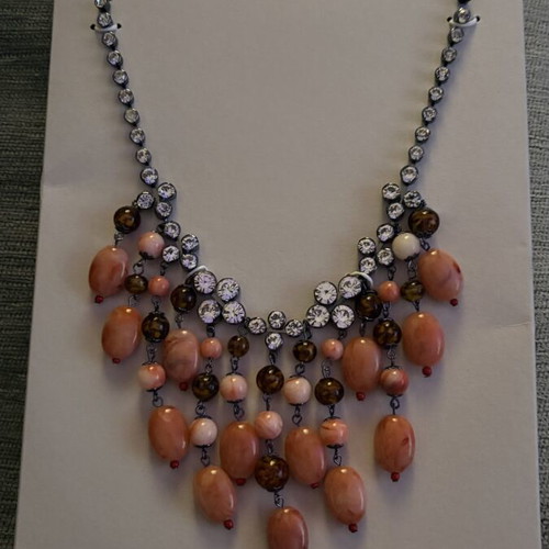 Waterfall style necklace with applique jewelry and colored stones