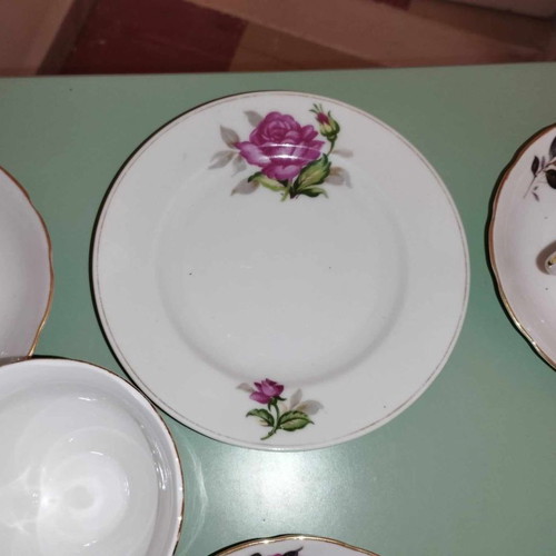 Vintage porcelain cup and saucer set with fuchsia roses