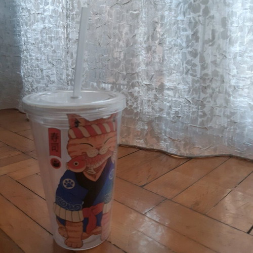 Cup with straw used, double wall for coffee and juices