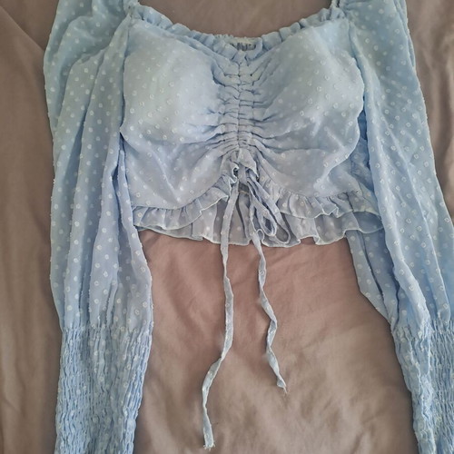 Luigi blue top like new with unique sleeves and bust ties