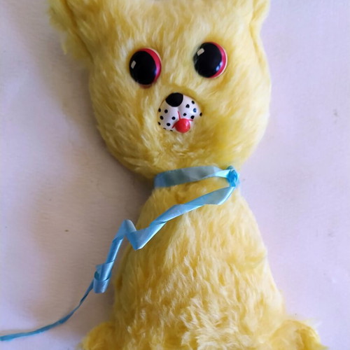 Vintage Greek plush toy, yellow with blue ribbon