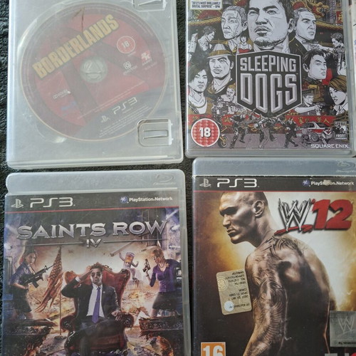 PlayStation 3 games pack with 7 titles and transparent controller like new