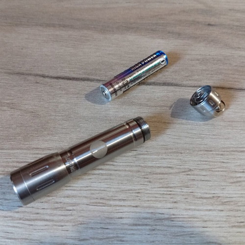 Mini stainless steel LED flashlight like new, AAA battery
