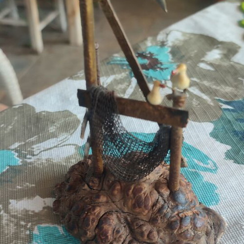 Vintage sea-themed decoration handmade from metal and cork used