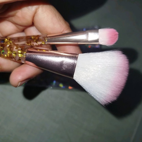 Makeup brushes used, set with small lipstick brush
