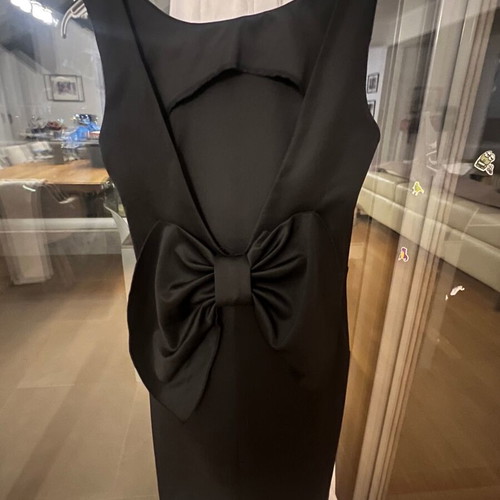 Black mini dress size S like new polyester with open back and large bow