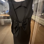 Black mini dress size S like new polyester with open back and large bow
