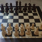 Chessboard with pieces and backgammon