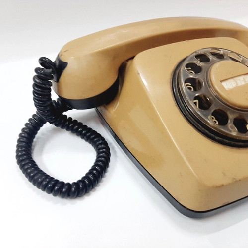 Vintage rotary phone used, beige, 1970s