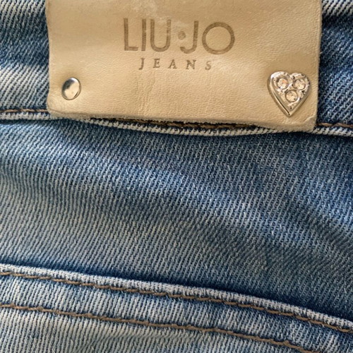 Blue skinny jeans like new with hearts, size XS