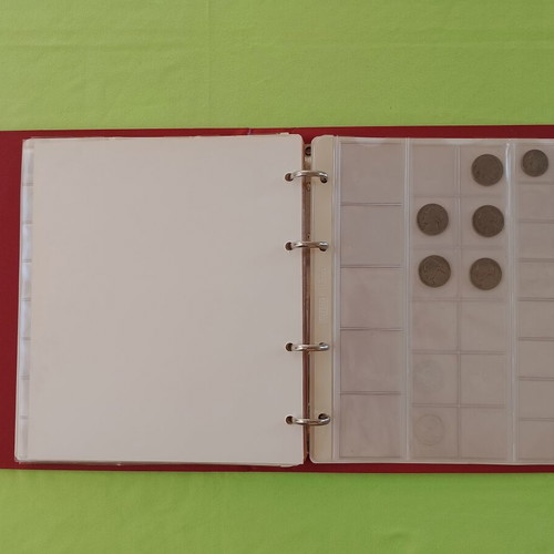 Coin album used with 5 slides for 133 coins
