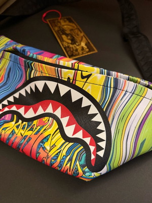 Sprayground Melt Graffiti crossbody bag like new, multicolor