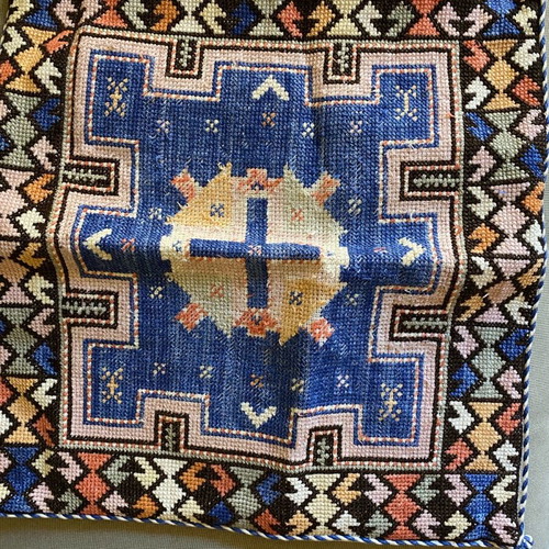 Embroidered pillow used with minor wear