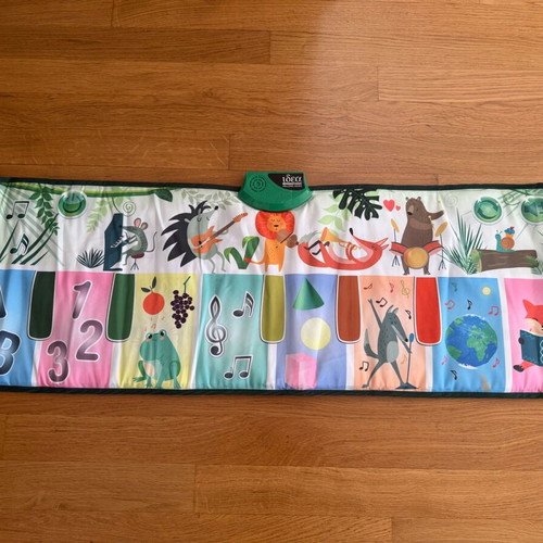 Children's floor piano with animals like new
