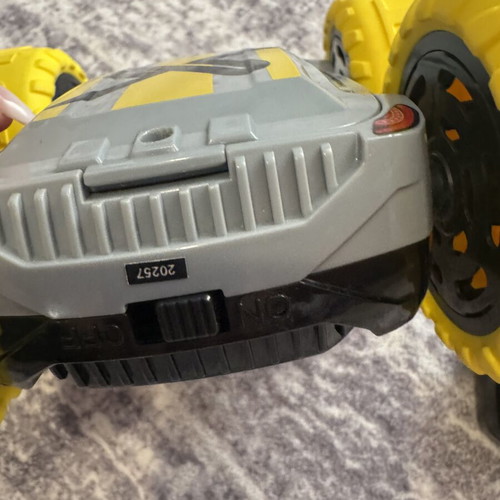 Exost 360 Cross remote control car used with yellow off-road wheels
