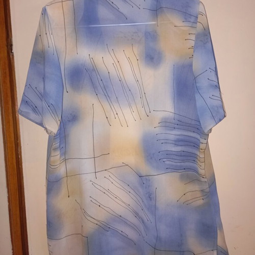 Light vintage women's shirt with short sleeves, buttons, collar, abstract print