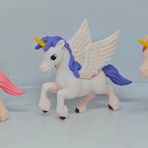 Set of 4 unicorn and pegasus figures like new