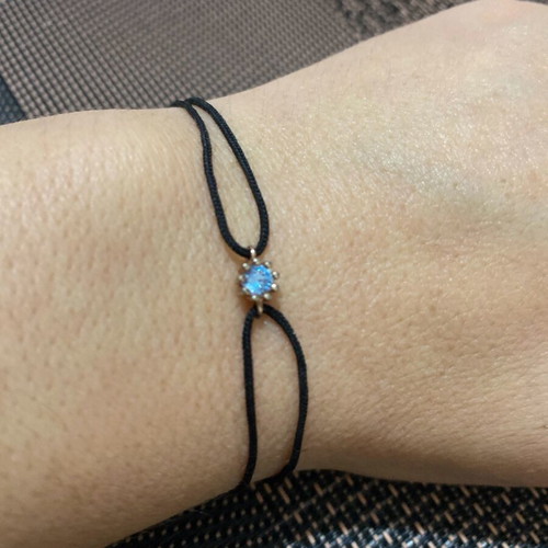 Bracelet with cord and silver pendant like new