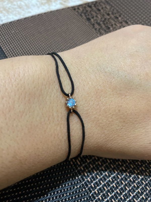 Bracelet with cord and silver pendant like new