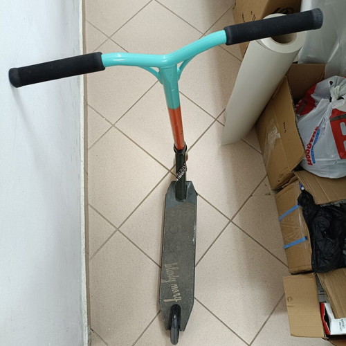 BMX stunt scooter used with scratched bottom