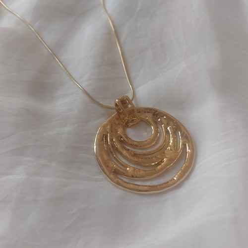 Golden Orbit statement necklace with circular pendant