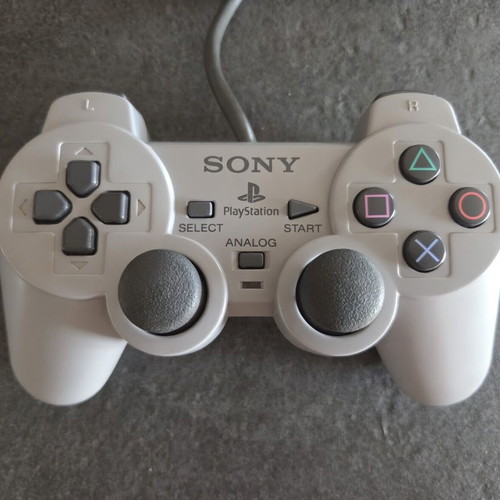 Sony PlayStation SCPH-7502 PS1 console used with Dualshock controller