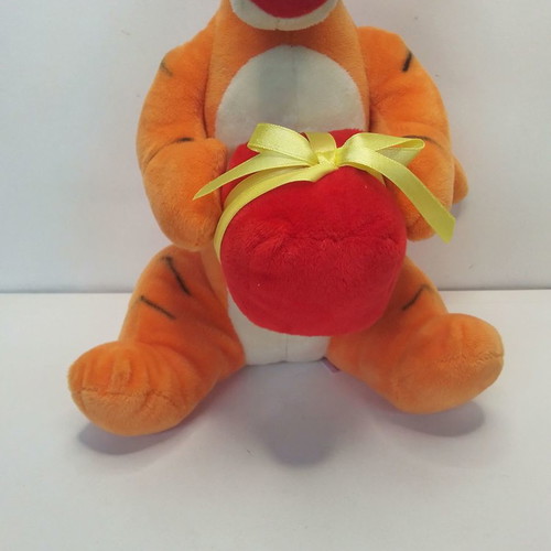 Disney Winnie Tigger plush used with birthday party hat