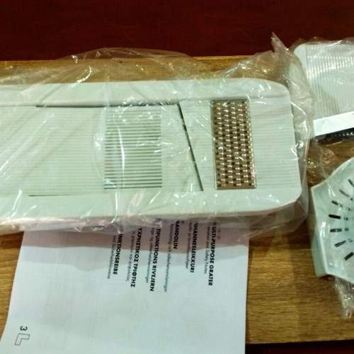 Multi-Purpose Grater new with accessories for slicing and shredding
