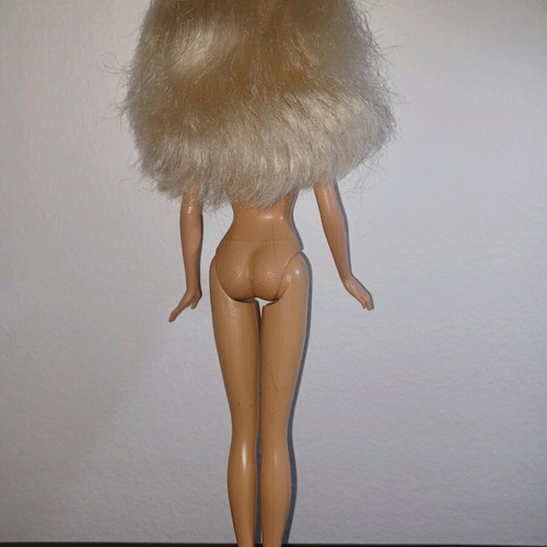 Barbie doll used with mark on knee