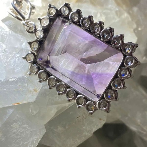 Silver pendant with large cut natural amethyst stone and moissanites