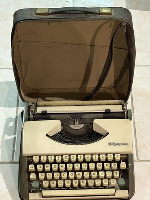 Olympia typewriter used with case, decorative