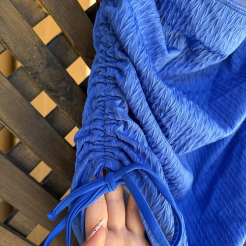 Blue swimsuit like new with adjustable side cords, draped bust, regular cut