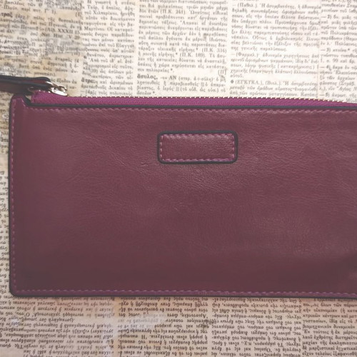 Leather wallet used with zipper in burgundy color